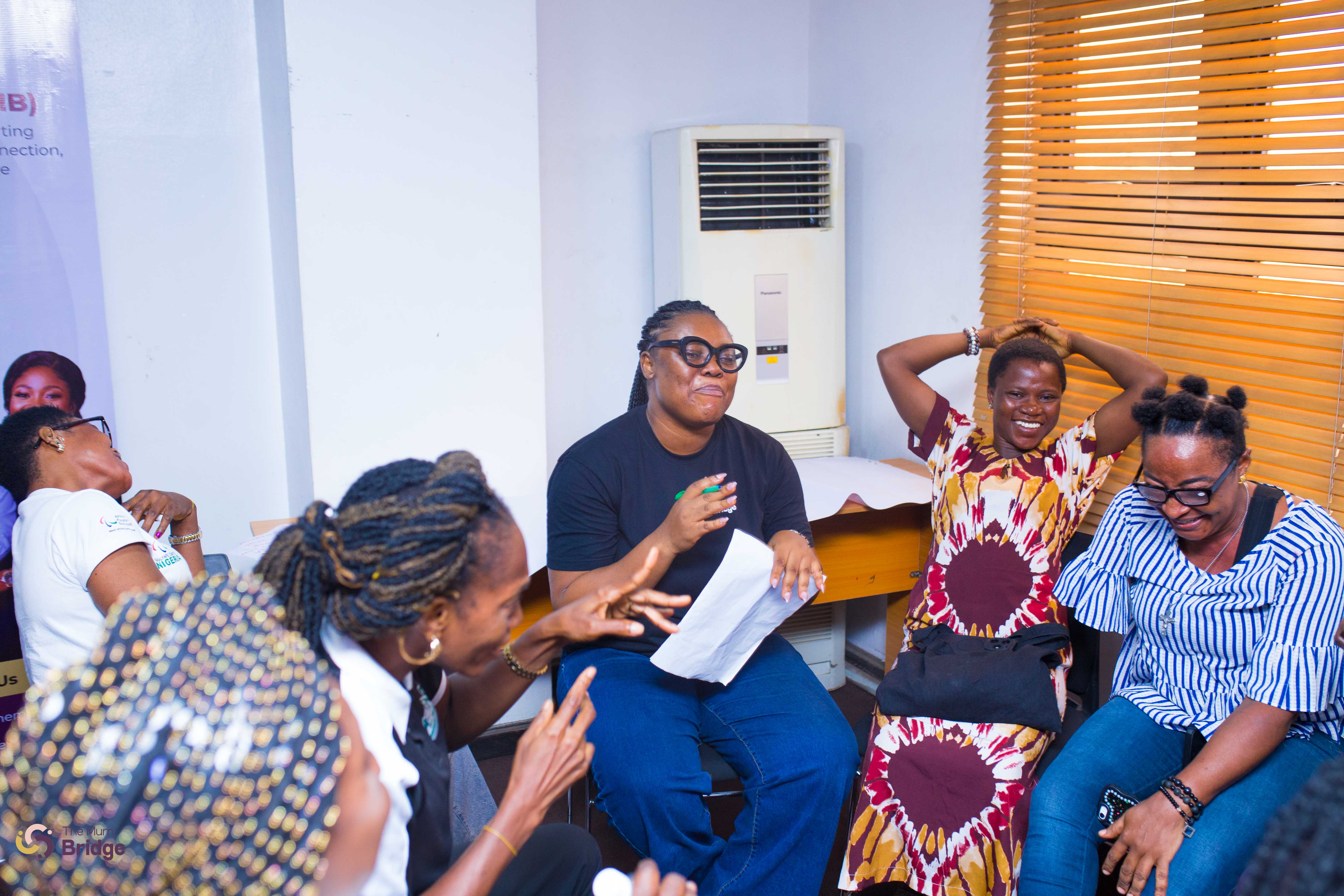 Community members sharing laughter and joy together during a Mum Bridge group activity